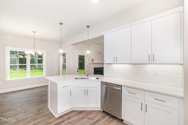 1000 Peedin Rd, Selma, NC 27576 - kitchen with dishwasher, backsplash, a peninsula, white cabinetry, and light countertops