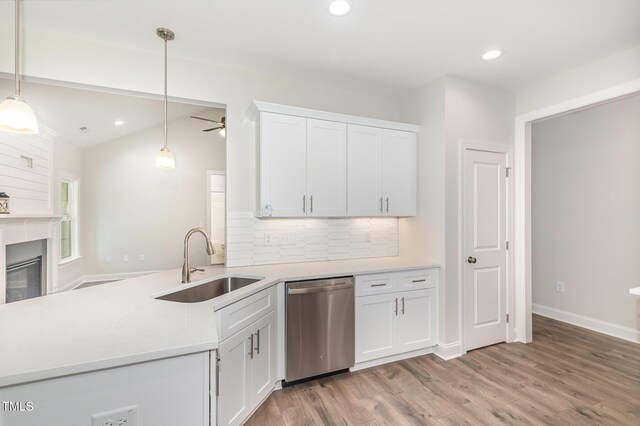 1000 Peedin Rd, Selma, NC 27576 - kitchen featuring stainless steel dishwasher, a ceiling fan, tasteful backsplash, white cabinets, and light countertops