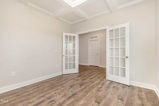 1000 Peedin Rd, Selma, NC 27576 - spare room featuring french doors, beamed ceiling, coffered ceiling, wood finished floors, and crown molding