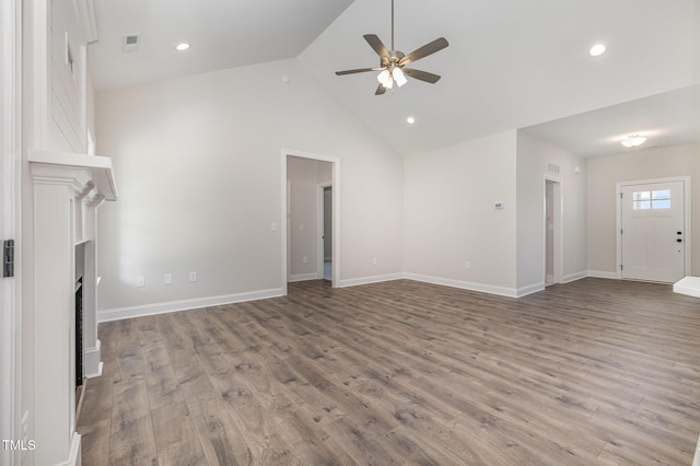 1000 Peedin Rd, Selma, NC 27576 - unfurnished living room featuring a ceiling fan, a fireplace, wood finished floors, high vaulted ceiling, and recessed lighting