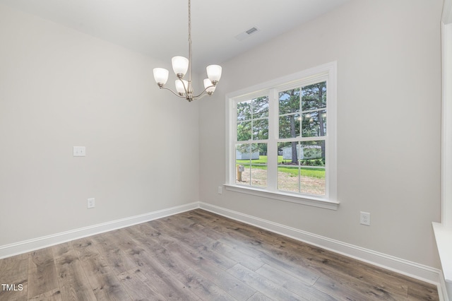 1000 Peedin Rd, Selma, NC 27576 - unfurnished room with a chandelier and wood finished floors