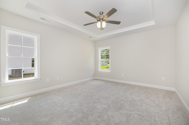 1000 Peedin Rd, Selma, NC 27576 - spare room with a tray ceiling, ornamental molding, light carpet, and a ceiling fan