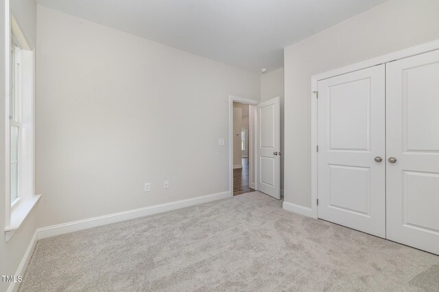 1000 Peedin Rd, Selma, NC 27576 - unfurnished bedroom with carpet and a closet