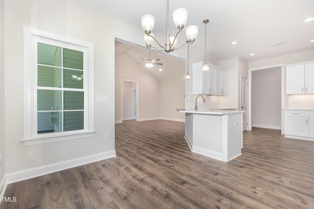 1000 Peedin Rd, Selma, NC 27576 - kitchen featuring backsplash, a chandelier, wood finished floors, recessed lighting, and vaulted ceiling