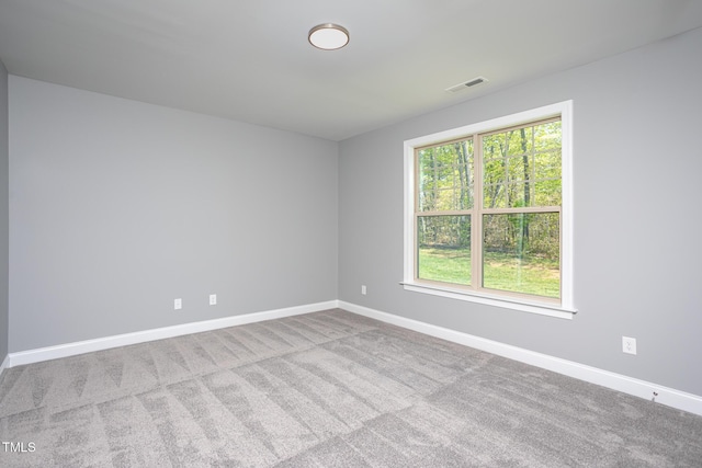 1007 Fairhaven Dr, Mebane, NC 27302 - carpeted spare room featuring baseboards and visible vents