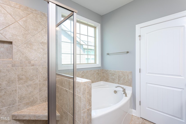1007 Fairhaven Dr, Mebane, NC 27302 - bathroom featuring a garden tub, tile patterned floors, and a stall shower