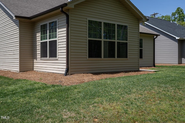1007 Fairhaven Dr, Mebane, NC 27302 - view of home's exterior with a lawn and roof with shingles