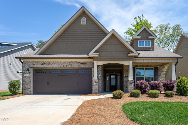 1007 Fairhaven Dr, Mebane, NC 27302 - craftsman-style house with brick siding, an attached garage, driveway, and a shingled roof