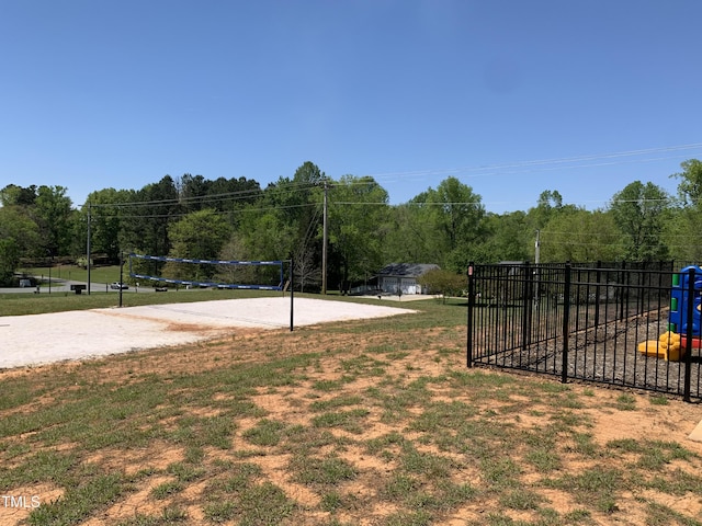 1007 Fairhaven Dr, Mebane, NC 27302 - exterior space featuring volleyball court, fence, and a lawn