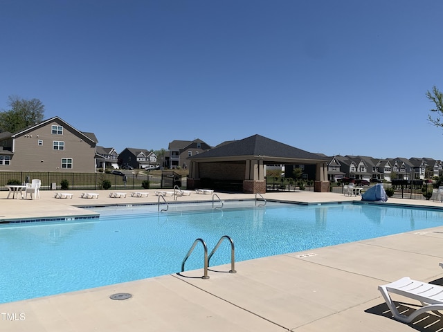 1007 Fairhaven Dr, Mebane, NC 27302 - community pool with fence, a residential view, and a patio