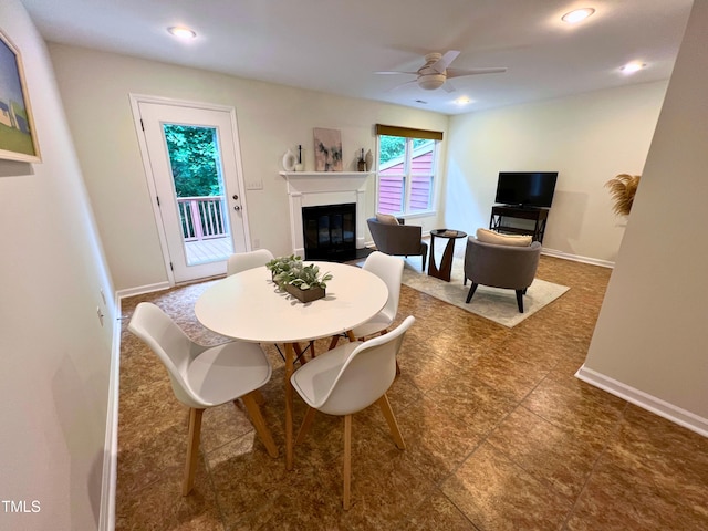 127 Long Shadow Pl, Durham, NC 27713 - dining room with a ceiling fan, a glass covered fireplace, baseboards, and recessed lighting