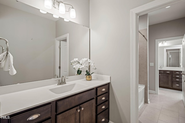 full bathroom featuring  shower combination, tile patterned floors, and vanity