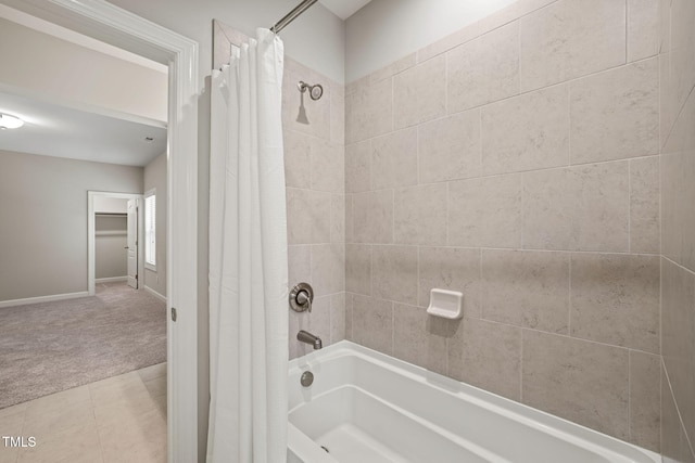 full bathroom with baseboards, shower / bath combination with curtain, and tile patterned floors