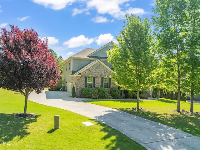 obstructed view of property with concrete driveway, brick siding, and a front yard