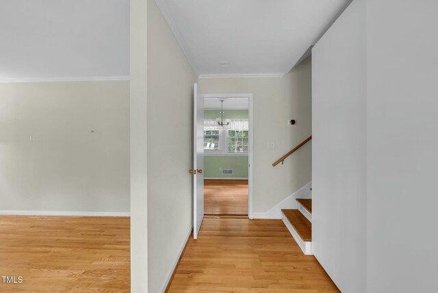 905 Cindy St, Cary, NC 27511 - corridor featuring visible vents, crown molding, stairway, baseboards, and light wood-style flooring