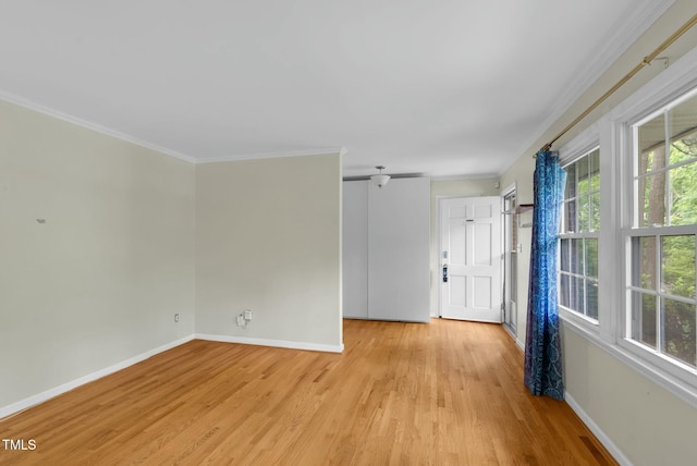 905 Cindy St, Cary, NC 27511 - empty room with baseboards, ornamental molding, and light wood-style flooring