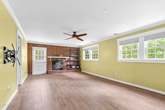 905 Cindy St, Cary, NC 27511 - unfurnished living room with crown molding, baseboards, ceiling fan, and wood finished floors