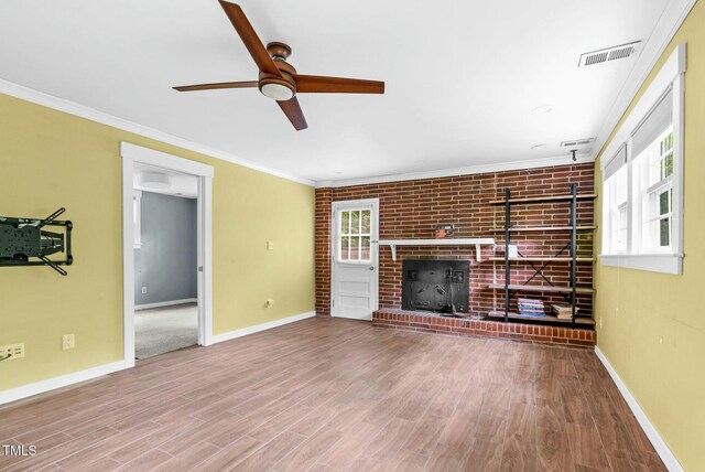 905 Cindy St, Cary, NC 27511 - unfurnished living room featuring baseboards, a ceiling fan, wood finished floors, and visible vents