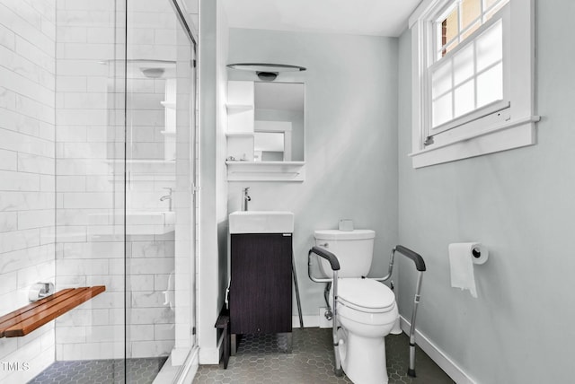 905 Cindy St, Cary, NC 27511 - bathroom with vanity, tile patterned flooring, a stall shower, and toilet