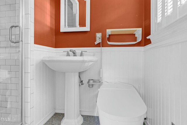 905 Cindy St, Cary, NC 27511 - bathroom featuring a shower stall and a wainscoted wall