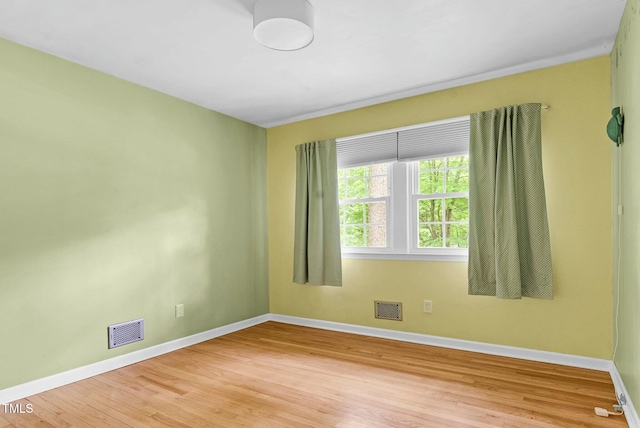 905 Cindy St, Cary, NC 27511 - empty room featuring baseboards, visible vents, and light wood-type flooring