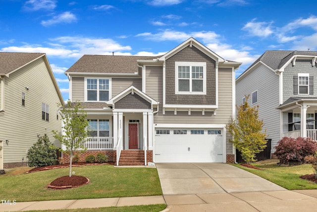 craftsman house featuring a shingled roof, a front lawn, an attached garage, driveway, and a porch