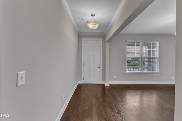 entryway with wood finished floors, visible vents, crown molding, and baseboards