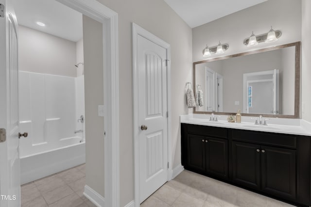 full bathroom with tile patterned flooring, a sink, and double vanity
