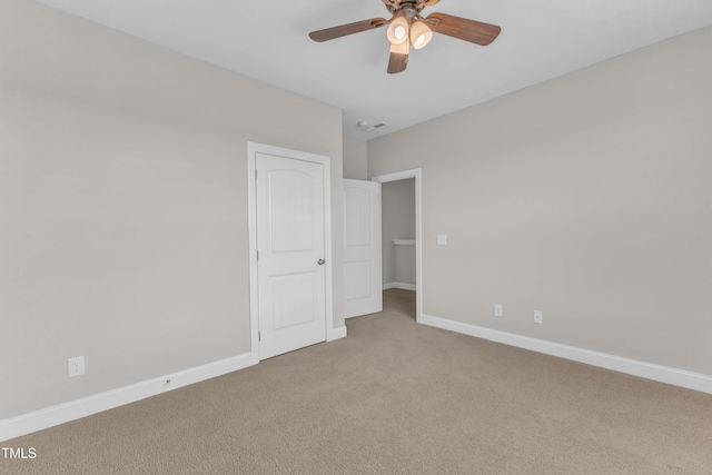 unfurnished bedroom featuring baseboards, a ceiling fan, and carpet flooring