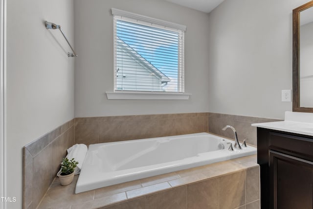 full bathroom with a bath and vanity