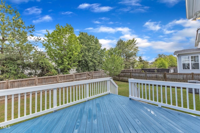 wooden terrace with a lawn, a fenced backyard, and cooling unit