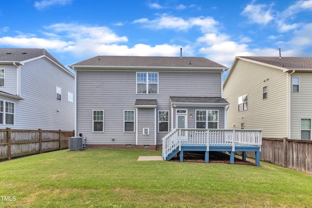 rear view of property featuring roof with shingles, a fenced backyard, cooling unit, a deck, and crawl space