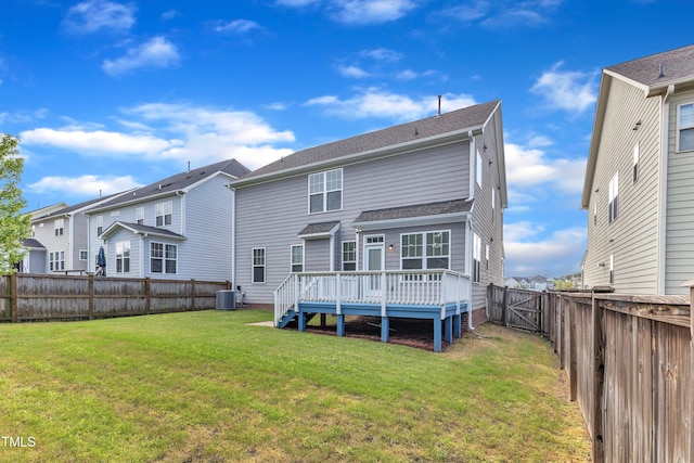 back of property featuring a lawn, a fenced backyard, central air condition unit, and a deck