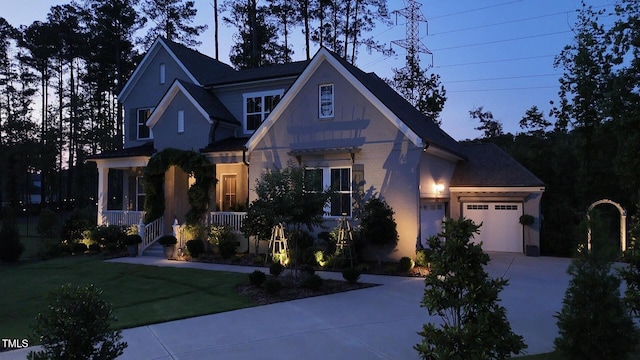 8208 Bella Oak Ct, Wake Forest, NC 27587 - view of front of property with concrete driveway, a garage, covered porch, and a front yard