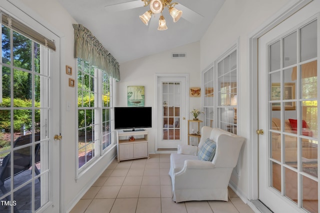 sunroom featuring vaulted ceiling, french doors, tile patterned floors, and visible vents