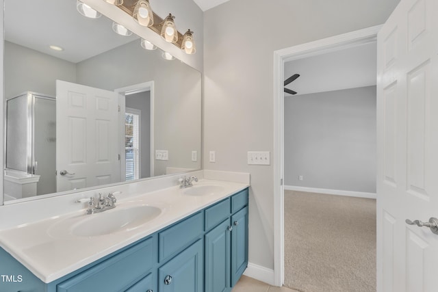 10603 Friendly Neighbor Ln, Raleigh, NC 27614 - full bathroom featuring double vanity, a shower with shower door, and baseboards