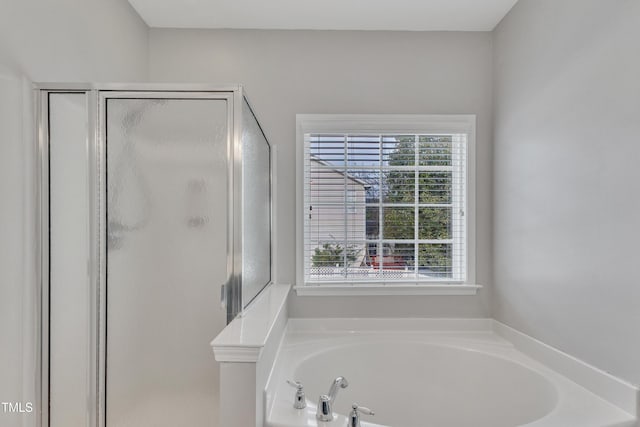 10603 Friendly Neighbor Ln, Raleigh, NC 27614 - full bath with a stall shower and a garden tub
