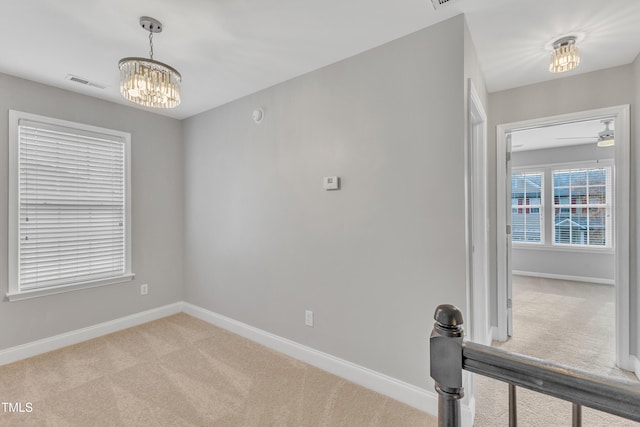 10603 Friendly Neighbor Ln, Raleigh, NC 27614 - unfurnished room with carpet flooring, a chandelier, and baseboards