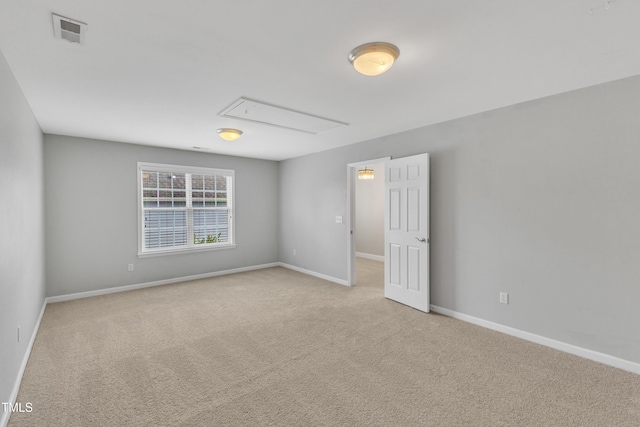 10603 Friendly Neighbor Ln, Raleigh, NC 27614 - unfurnished room featuring light carpet, attic access, and baseboards