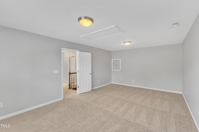 10603 Friendly Neighbor Ln, Raleigh, NC 27614 - spare room featuring attic access, light colored carpet, and baseboards