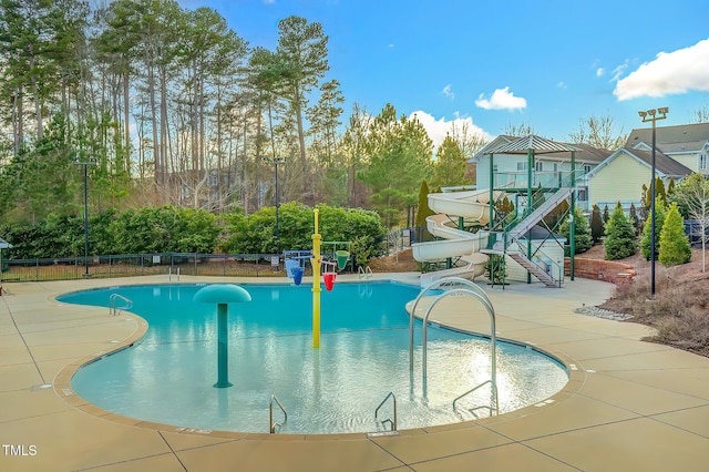 10603 Friendly Neighbor Ln, Raleigh, NC 27614 - community pool featuring a water slide and a patio