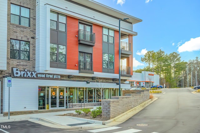 10603 Friendly Neighbor Ln, Raleigh, NC 27614 - view of building exterior with uncovered parking