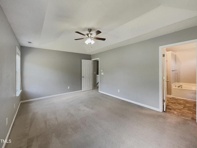 10 Sandy Bluff Ct, Durham, NC 27703 - unfurnished bedroom featuring vaulted ceiling, baseboards, carpet, ceiling fan, and ensuite bath