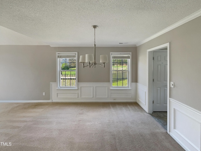 10 Sandy Bluff Ct, Durham, NC 27703 - unfurnished dining area with a textured ceiling, carpet, a healthy amount of sunlight, and a notable chandelier