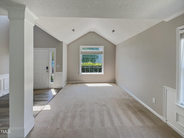 10 Sandy Bluff Ct, Durham, NC 27703 - carpeted entrance foyer featuring vaulted ceiling, a textured ceiling, and visible vents
