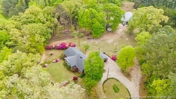 view from above of property with a forest