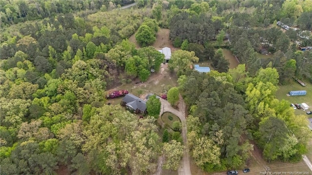 aerial overview of property's location featuring a forest