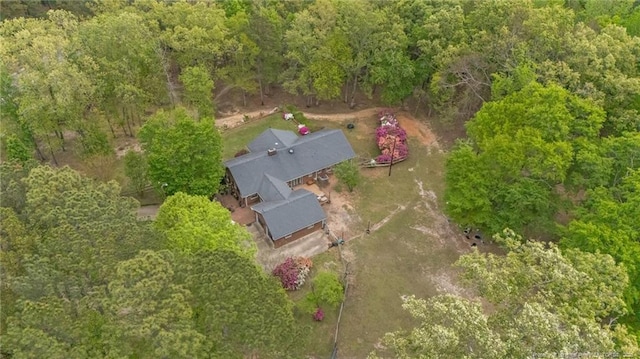aerial view of property and surrounding area with a forest