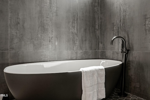 full bathroom with a soaking tub