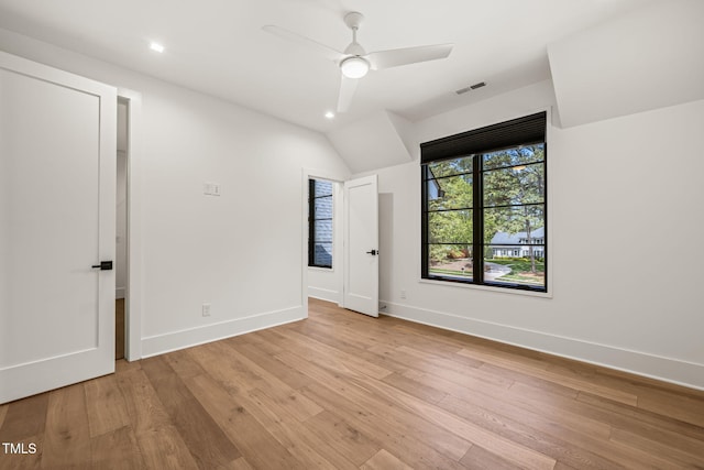 unfurnished bedroom with visible vents, light wood-style floors, and baseboards